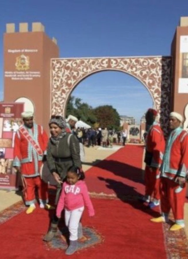 adults and a girl standing